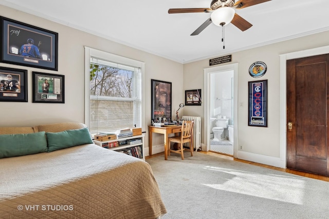 carpeted bedroom with crown molding, connected bathroom, and radiator heating unit