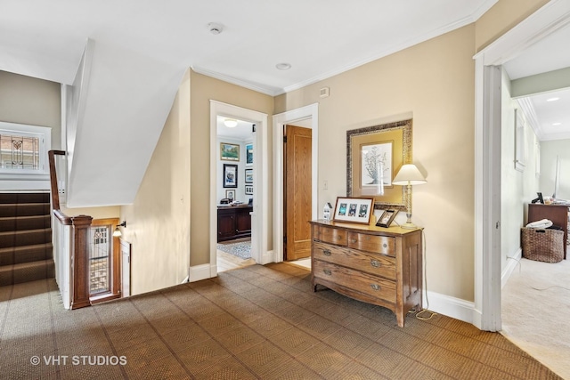 corridor with crown molding and dark carpet