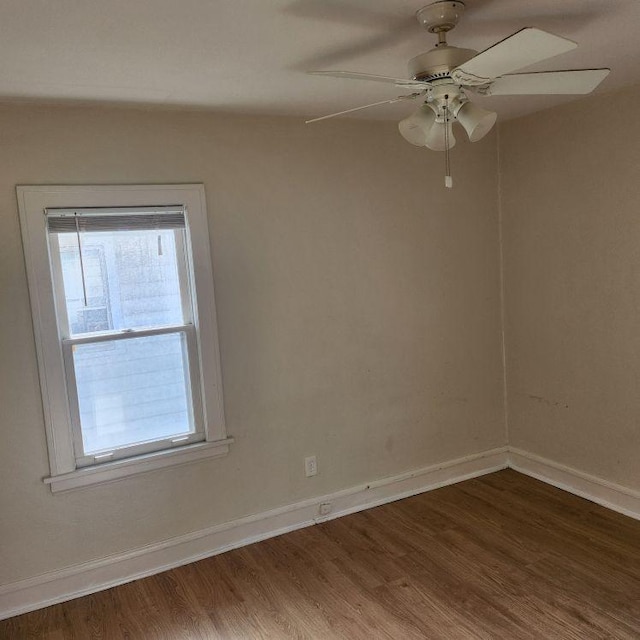 spare room featuring ceiling fan and hardwood / wood-style flooring