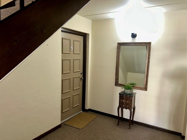 view of carpeted foyer