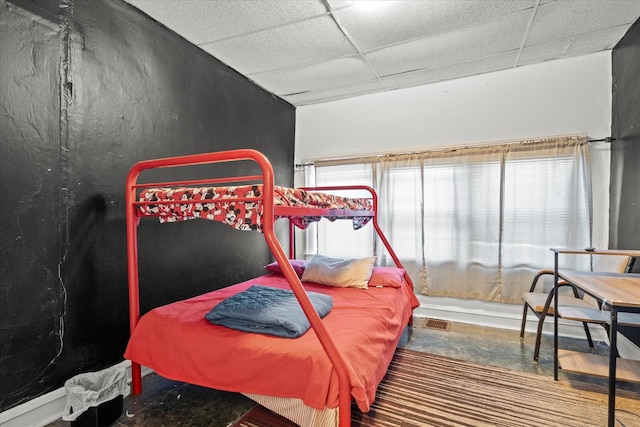 bedroom featuring a drop ceiling