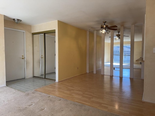 unfurnished room featuring a ceiling fan and wood finished floors