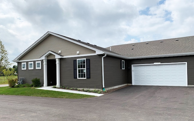 single story home with a garage