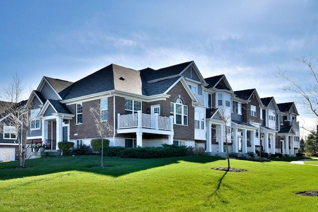 view of property featuring a front lawn