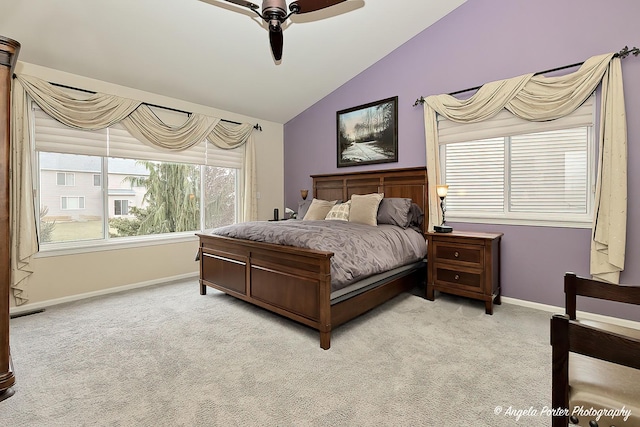 carpeted bedroom featuring ceiling fan and lofted ceiling