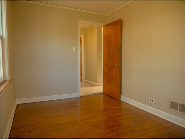 unfurnished room featuring hardwood / wood-style flooring