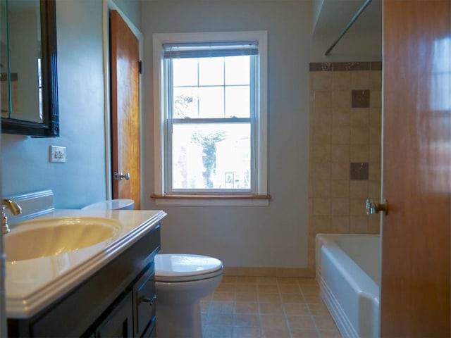 full bathroom featuring tile patterned flooring, vanity, toilet, and tiled shower / bath combo