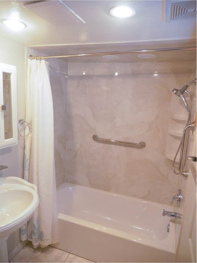 bathroom with tile patterned floors and shower / tub combo with curtain