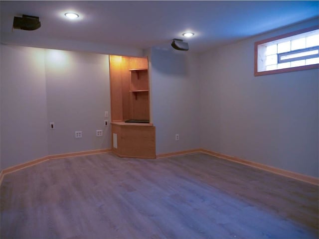 basement featuring hardwood / wood-style flooring