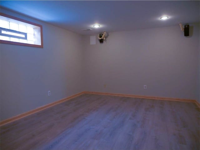 basement featuring hardwood / wood-style flooring