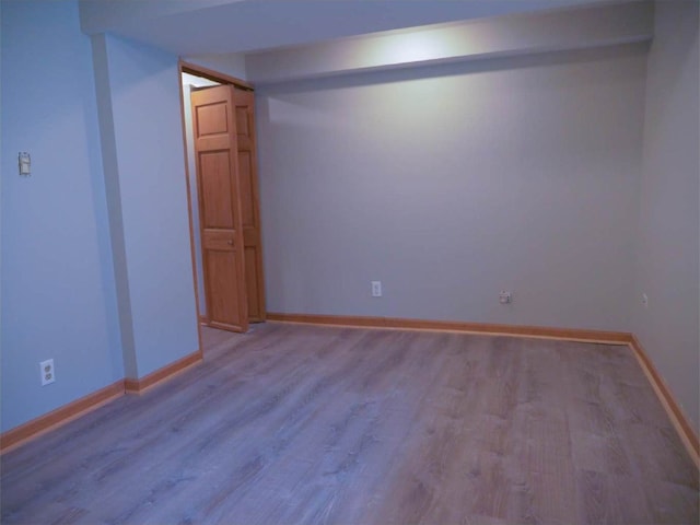 spare room featuring light wood-type flooring