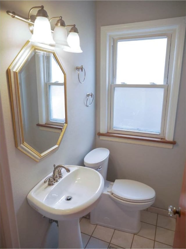 bathroom with tile patterned floors, toilet, and sink