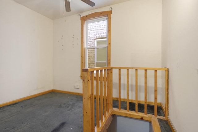 carpeted empty room with ceiling fan