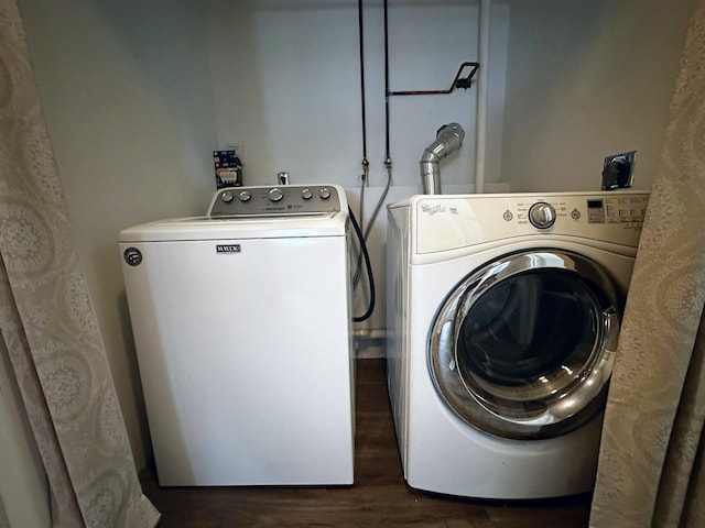 washroom featuring independent washer and dryer and dark wood-type flooring