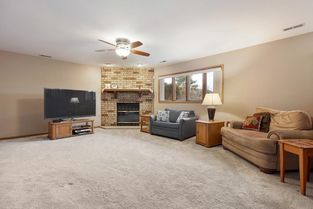 living room with light carpet, a brick fireplace, and ceiling fan