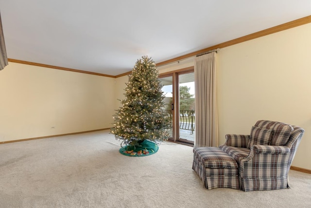 living area featuring carpet flooring and crown molding