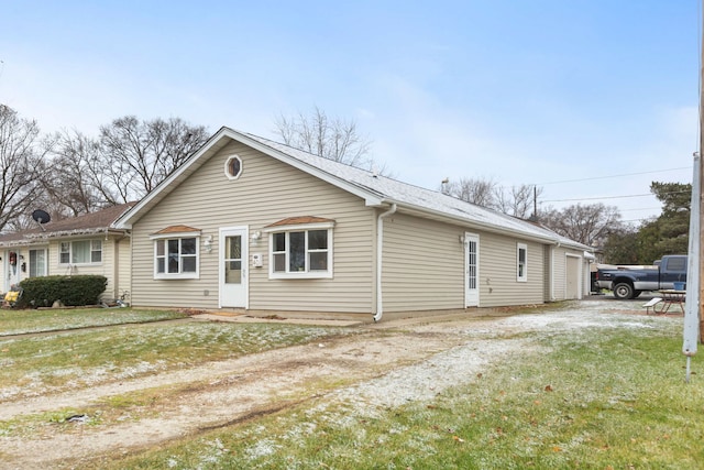 view of front of property with a garage and a front yard