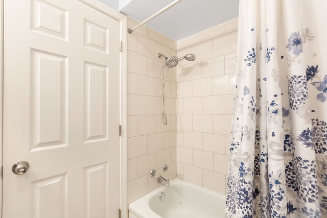 bathroom featuring shower / tub combo with curtain