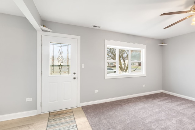 foyer featuring light wood-type flooring and ceiling fan