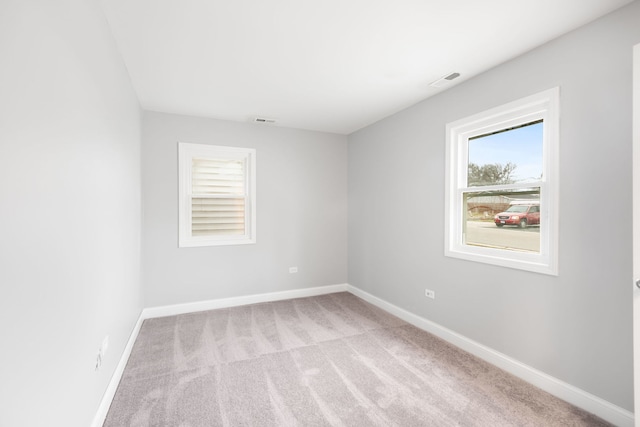 empty room with light colored carpet