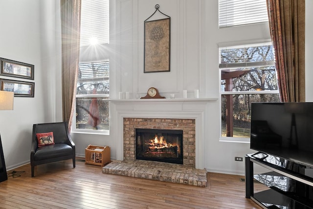 sitting room featuring light hardwood / wood-style flooring and a fireplace