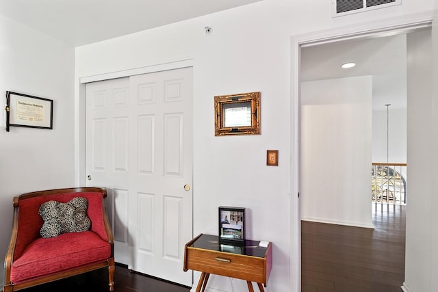 sitting room featuring dark hardwood / wood-style flooring