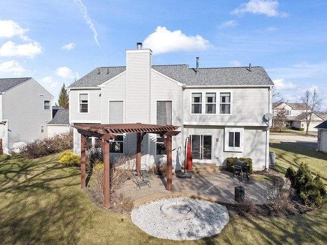 rear view of property featuring a patio area, a lawn, and a pergola