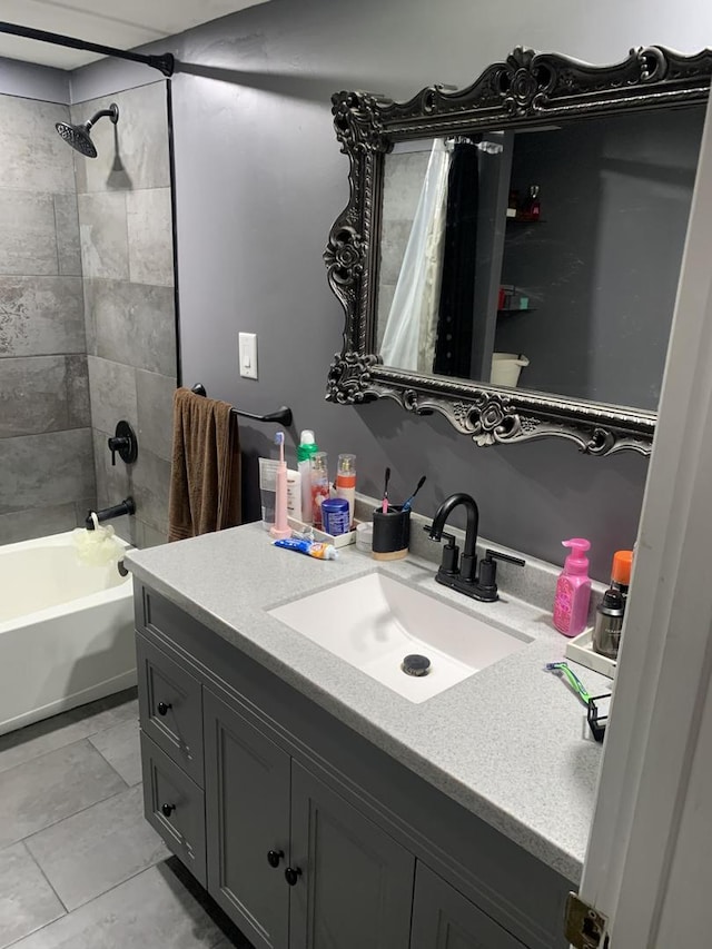 bathroom featuring shower / bath combo and vanity