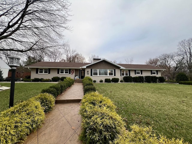 ranch-style home with a front yard