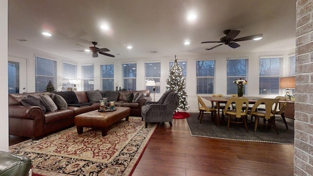 living room featuring dark hardwood / wood-style floors and ceiling fan