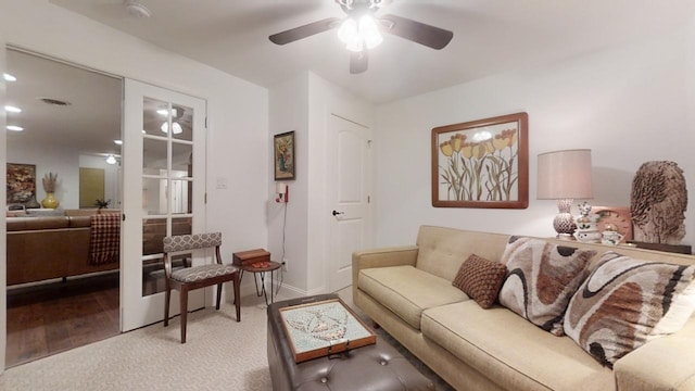 living room with hardwood / wood-style flooring and ceiling fan