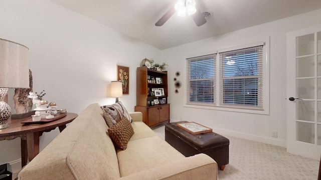 carpeted living room featuring ceiling fan