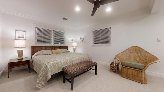 carpeted bedroom featuring ceiling fan and ornamental molding