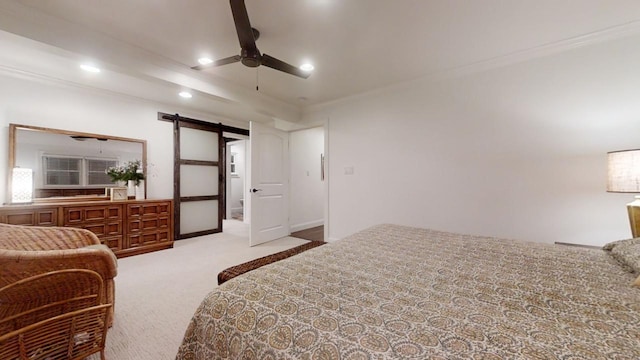 carpeted bedroom featuring a barn door, ceiling fan, and ornamental molding