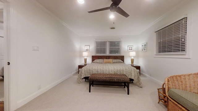 bedroom with ceiling fan, light carpet, and ornamental molding