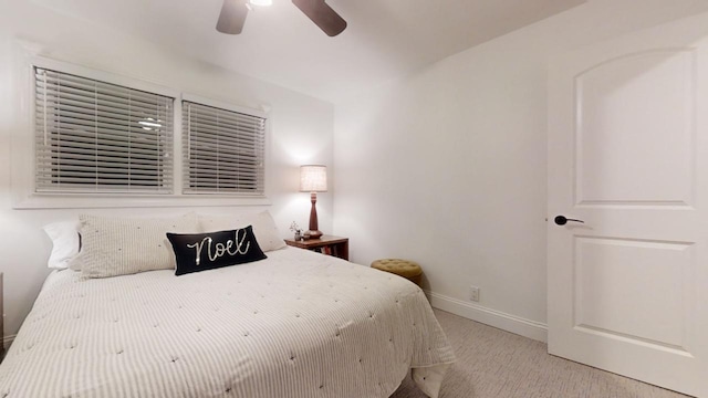 bedroom featuring ceiling fan and light colored carpet