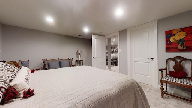 bedroom featuring light carpet