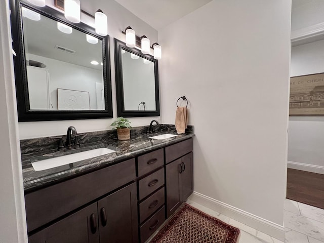 bathroom with vanity and hardwood / wood-style flooring