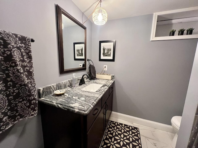 bathroom with vanity and toilet