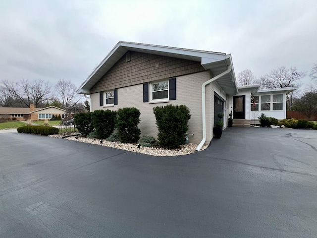 view of property exterior featuring a garage