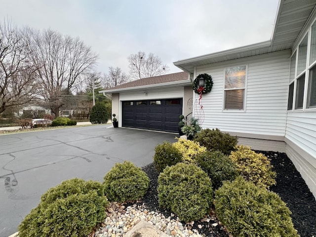 view of side of property featuring a garage