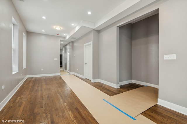 hall with hardwood / wood-style floors