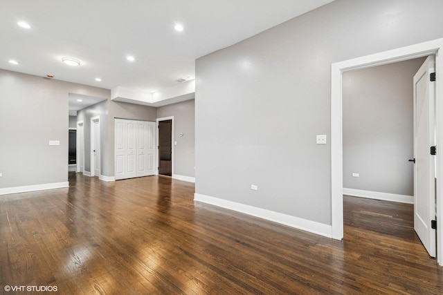 unfurnished room featuring dark hardwood / wood-style floors