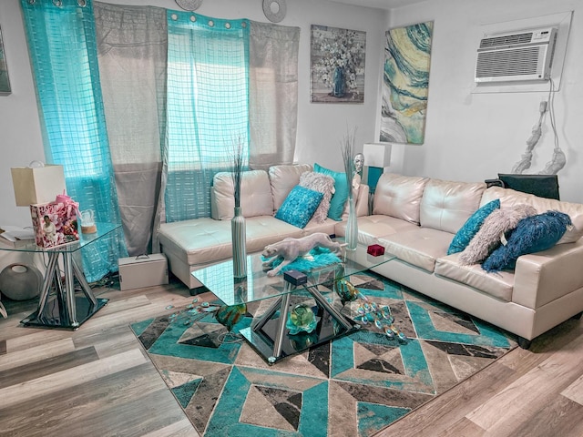 living room featuring an AC wall unit and hardwood / wood-style flooring