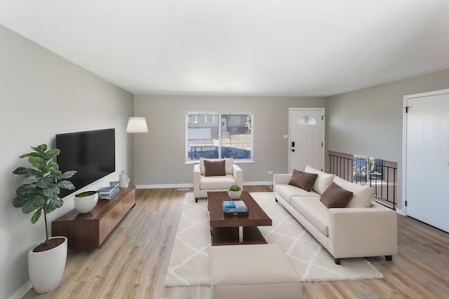 living room with light hardwood / wood-style floors