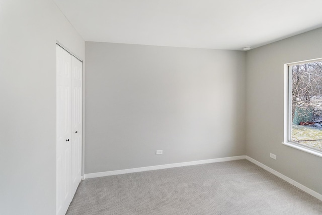 unfurnished room featuring carpet flooring