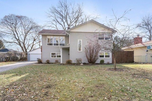 front of property with a front yard and a garage