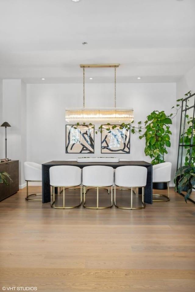 dining space with light hardwood / wood-style floors