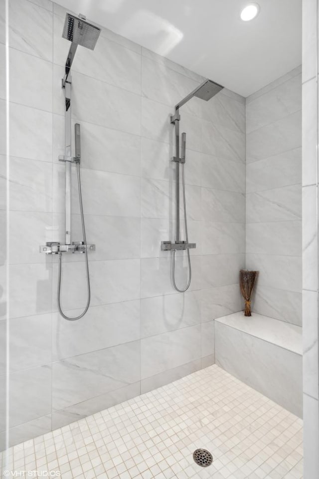 bathroom with tiled shower