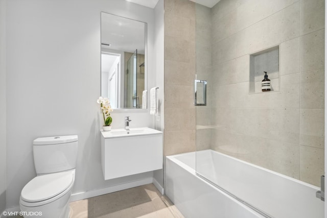 full bathroom with tile patterned floors, vanity, toilet, and bath / shower combo with glass door